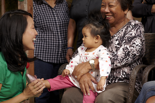 Jane Kim walking with two younger San Franciscans