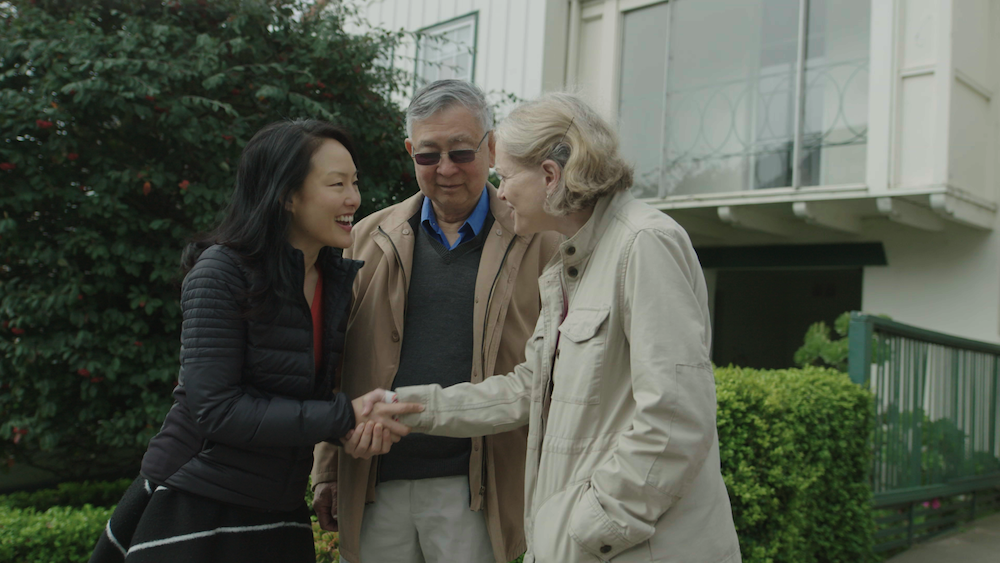 Jane Kim walking with two younger San Franciscans